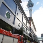 The Sky Tower and firetrucks on Federal Street, Auckland