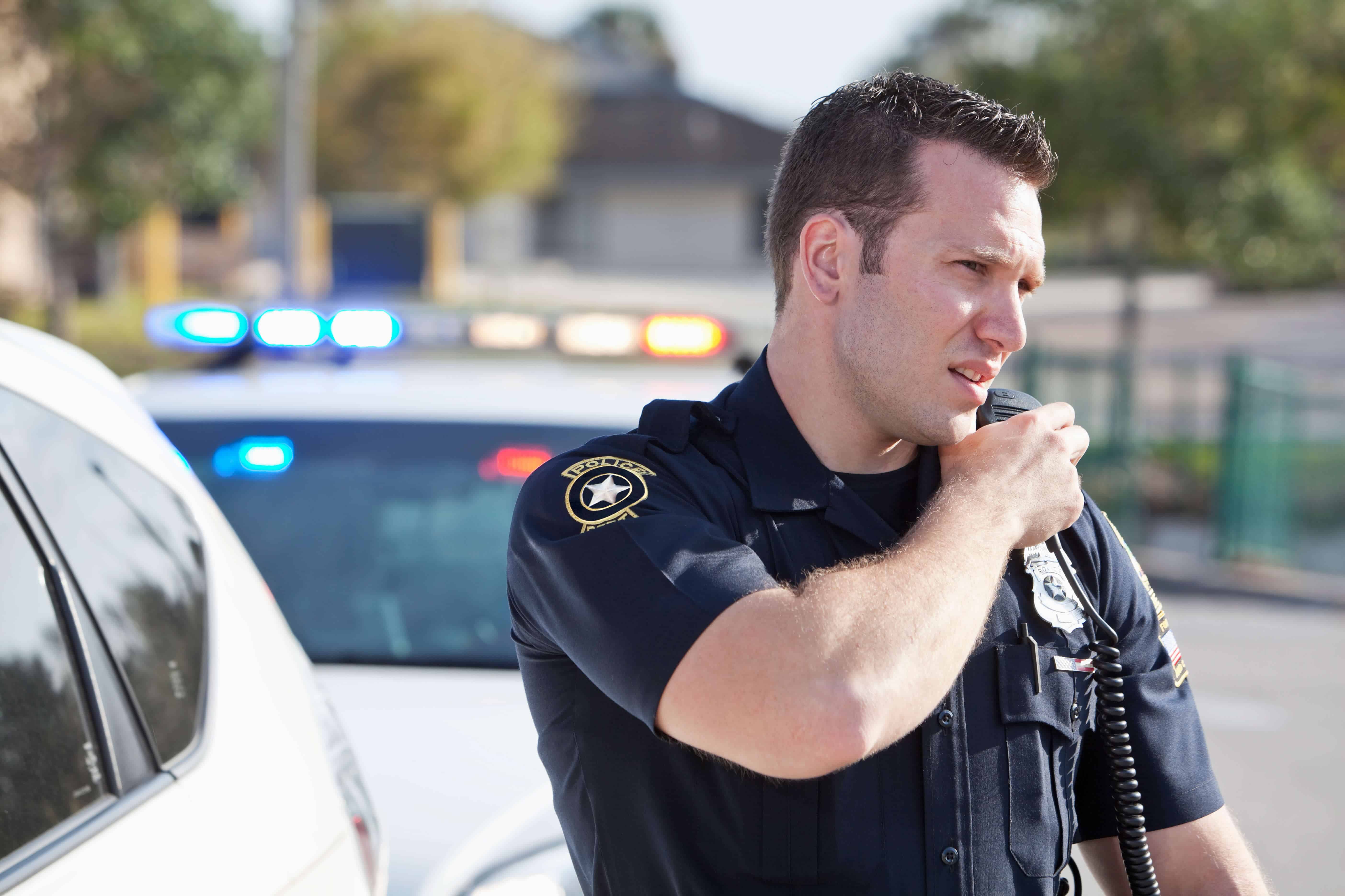 Police officer talking on radio