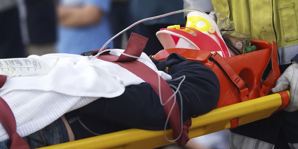 Patient being wheeled away in an apparatus