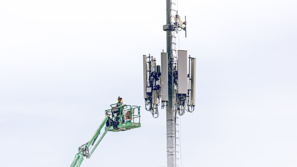 Utilities Cellular Tower Technician on a Cherrypicker