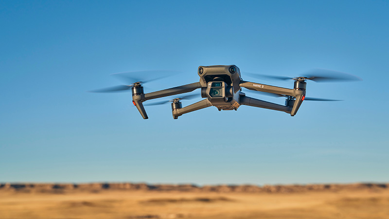 Grover, CO, USA - November 22, 2021: Mavic 3, an advanced, foldable consumer drone by DJI is flying at sunset over prairie in Colorado.